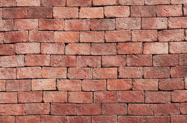 Naked orange brick wall surface. Brick texture background for design, wallpaper construction building.