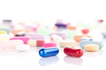 Red and blue pill concept representing a difficult choice, decision, or dilemma between reality and illusion.