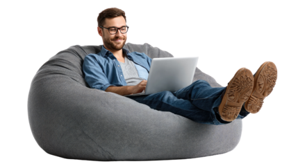 Relaxation and Technology: A man is comfortably seated on a beanbag chair, his attention captivated by his laptop