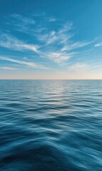 Fototapeta premium Calm Ocean Horizon With Scattered Clouds During the Daytime
