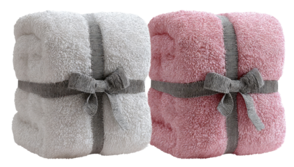 Two plush, wrapped blankets, one white, one pink
