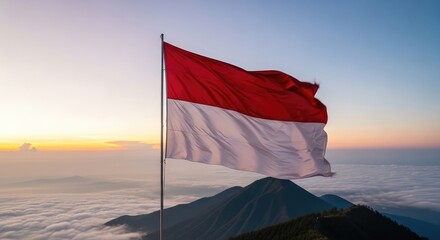 Indonesian flag waving over misty mountains