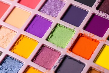 Fototapeta premium Photo of vibrant eyeshadow palette with various colorful pigments and textures for makeup application