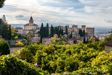 Naklejka premium The watchtowers of the Alhambra, seen from the way to the Generalife. Alhambra, Granada, Spain