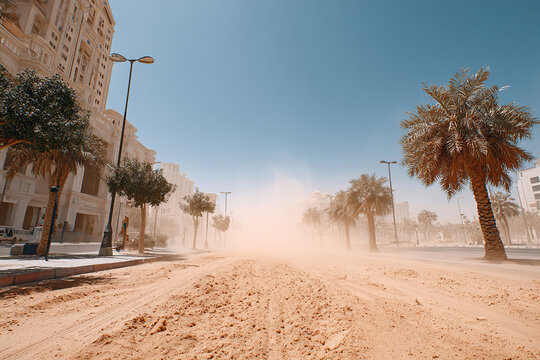 Dust storm sweeps through urban streets during mid-afternoon heat in a city setting