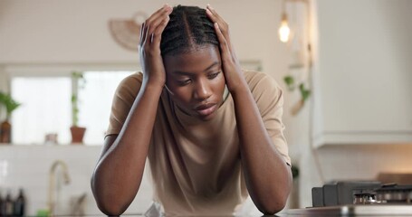 Black woman, headache and stress with depression in kitchen for overworked, strain or pressure. Female person, mental health and tired with pain or migraine for fatigue, burnout or burden in home - Powered by Adobe