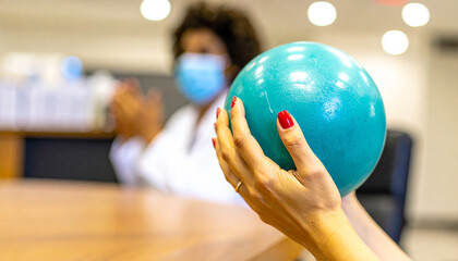 Red Nails and a Turquoise Ball: A Focused Moment in a Masked Meeting