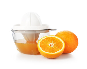 Juicer with fresh oranges isolated white. Making juice
