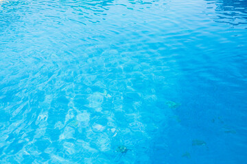 The Sunlight Reflecting on a Blue Water Surface. Concept The beautiful play of light.