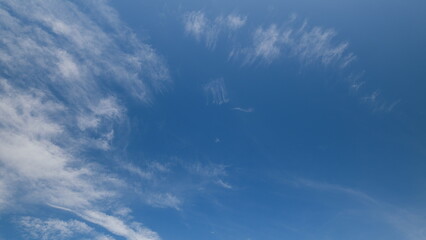 Time lapse. A beautiful Azure Sky adorned with Wispy Clouds on a clear day, evoking a sense of peace