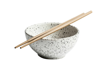 Ceramic bowl with chopsticks isolated on transparent background. Pair of bamboo chopsticks placed across a speckled ceramic bowl isolated on white background.