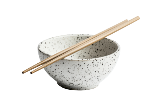Ceramic bowl with chopsticks isolated on transparent background. Pair of bamboo chopsticks placed across a speckled ceramic bowl isolated on white background.