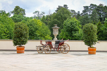 An antique carriage in the castle courtyard. Valtice in the Moravian region of the Czech Republic.
