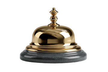 Polished gold service bell on dark stone base