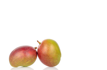 Ripe juicy mangoes on a white background, close-up.