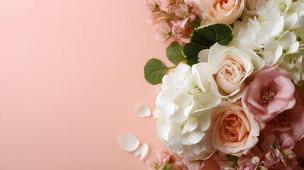 Assortment of Pink and White Flowers Including Roses and Hydrangeas Arranged on a Pastel Pink Background