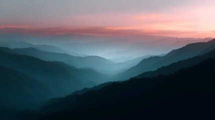 Misty mountain range at sunrise with warm atmospheric lighting