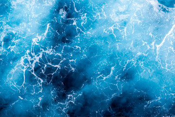 Fototapeta premium Sea water surface texture. Aerial view of breathtaking water with foam. Can be used in covers, packaging, posters, textures, presentations, art and design projects. Captivating vector illustration.