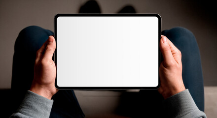 Naklejka premium Person Holding a Modern Digital Tablet with Blank White Screen