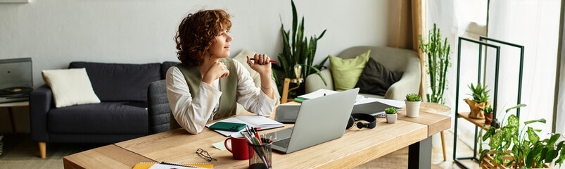 Curly-haired freelancer enjoying summer vibes while working from home in cozy apartment
