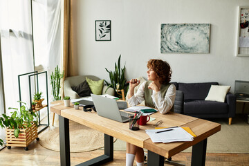 Fototapeta premium Young woman with curly hair embraces freelance life working from home in summer