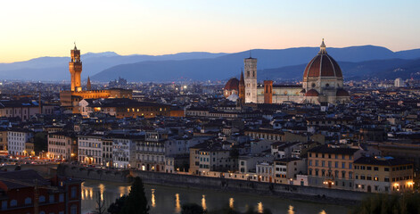 Obraz premium night view Florence city Central Italy Tuscany Region with streetlight reflections on Arno River