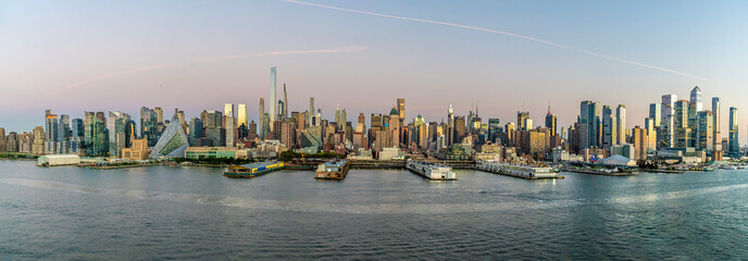 A panorama view approaching dusk from the Hudson River across the skyline of Manhattan, New York, in the fall © Nicola
