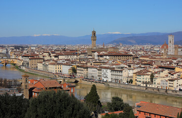 Obraz premium Florence called FIRENZE in Italy with famous landmarks and Arno River and mountains