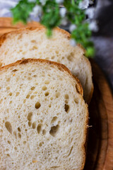 sliced bread on wooden board. Sourdough bread made at home from a scratch. 