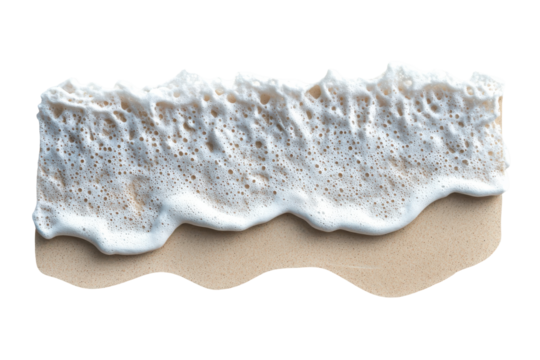 Ocean wave breaking on sandy beach isolated on transparent background. Top view of ocean waves gently lapping onto a sandy beach isolated on white background.