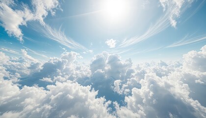 A vista of endless clouds illuminated by bright sunlight and a beautiful gradient of blue sky on a clear day