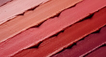 Horizontal swatches of deep rose and mauve lipstick shades