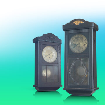 Antique and old two brown and black color wall clocks on gradient white and green background, object, technology, decor, ancient, old, fashion, copy space