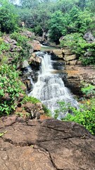 Obraz premium view of waterfall over rocks