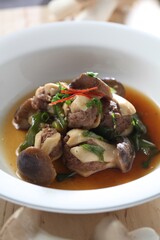 King oyster mushrooms filled with beef, simmered in soy garlic broth. Well-balanced in taste and nutrition. A dish by Master Chef Hanshunseop. Photographed in Korea.