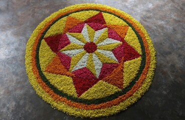 pookalam designs for onam celebrations , pookalam made for part of onam celibration in kerala, india. it also referred to as athapookalam, is often made in a circular shape with flowers on floor