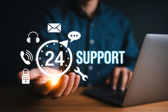Always available twenty four hour support concept depicting customer service with digital icons and a man working on his laptop in the background - Powered by Adobe