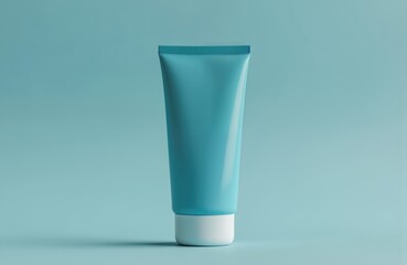 Blue tube stands out against light blue background. 3D mockup of plastic container with liquid product inside. Central, slightly tilted, blue object for cosmetic design.