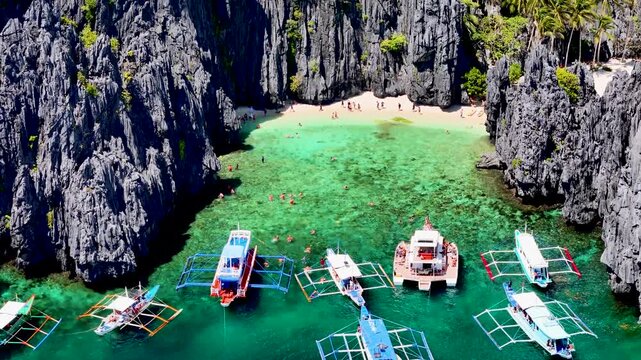 Secret Lagoon at Miniloc Island near El Nido, Palawan, Philippines. Aerial 4K drone top view video footage of unique lagoon among limestone cliffs on island hopping 