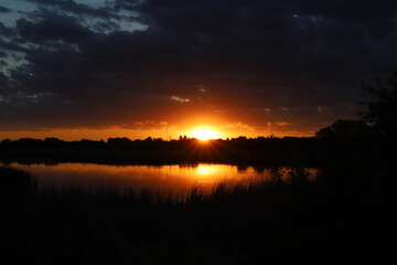 Obraz premium sunset over the river