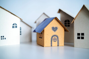 Blue roof houses in among white houses for real estate