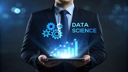 Man in suit displays data science concepts on tablet