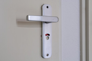 bathroom door handle showing occupied