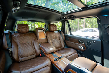 Experience the opulent luxury interior of a highend SUV, complete with a stunning panoramic sunroof and plush premium leather seating that provides unmatched comfort for all passengers
