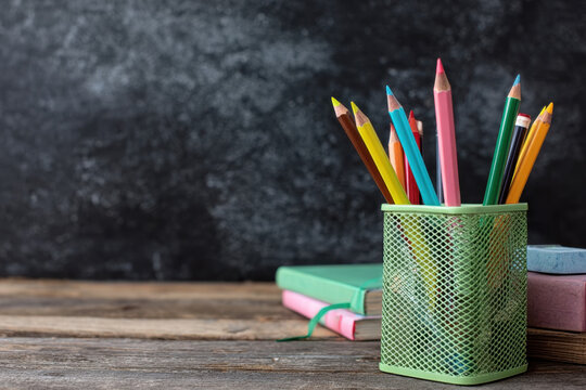 Apple On Stack Books With Pencils And Alarm Clock - Back To School