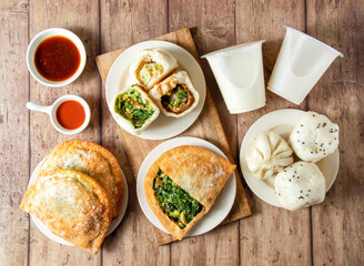 Vegetable and Meat Buns, Fried Chive Box, Chive Buns, Fresh Meat Buns, Pan Fried Buns, Drink with sauce and ketchup side view of taiwan food