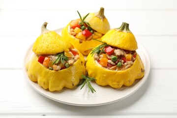 Tasty stuffed pattypan squashes on white wooden table, closeup