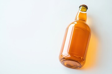 Fototapeta premium Amber glass bottle of beverage, angled view.
