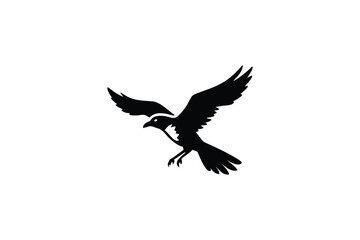Obraz premium A stark black silhouette of a raven in mid flight with wings spread wide and talons extended captured against a clean white background in a distinctive silhouette style