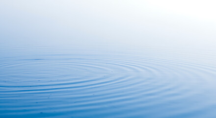 Fototapeta premium Serene blue water surface with gentle ripples creates a calming, peaceful atmosphere for relaxation and meditation.